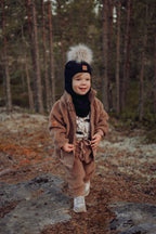 Metsola – Merino Fur Pom Pom Helmet | BLACK