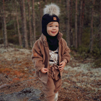 Metsola – Merino Fur Pom Pom Helmet | BLACK